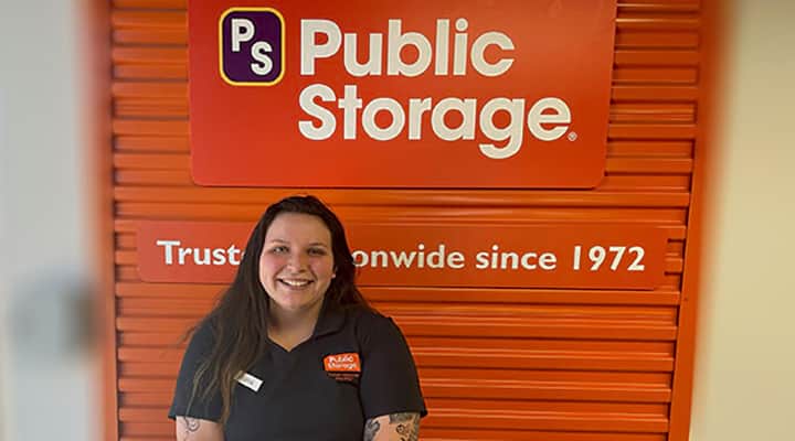 public storage employee smiles after completing virtual fitness challenge